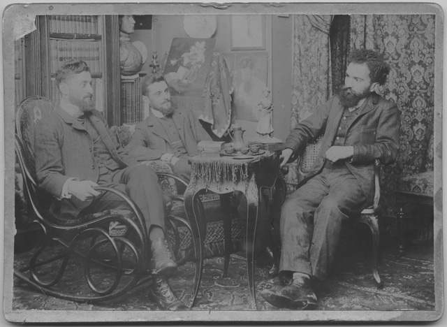 Tre uomini in un salotto a Parigi