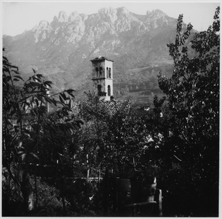 Veduta di Sonvico con i Denti della Vecchia