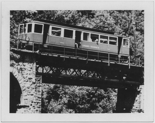 Passaggio del convoglio della ferrovia Lugano-Tesserete sul ponte della Ganna